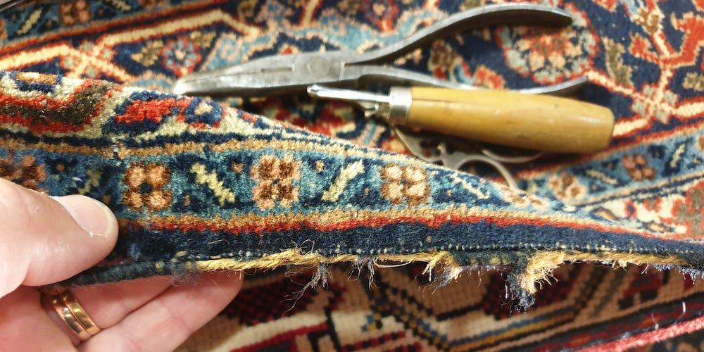 Artisan restaure un tapis à Maison-Laffitte
